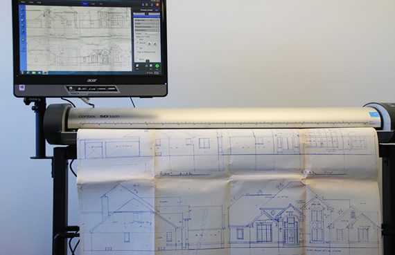 a scanner scanning blueprints